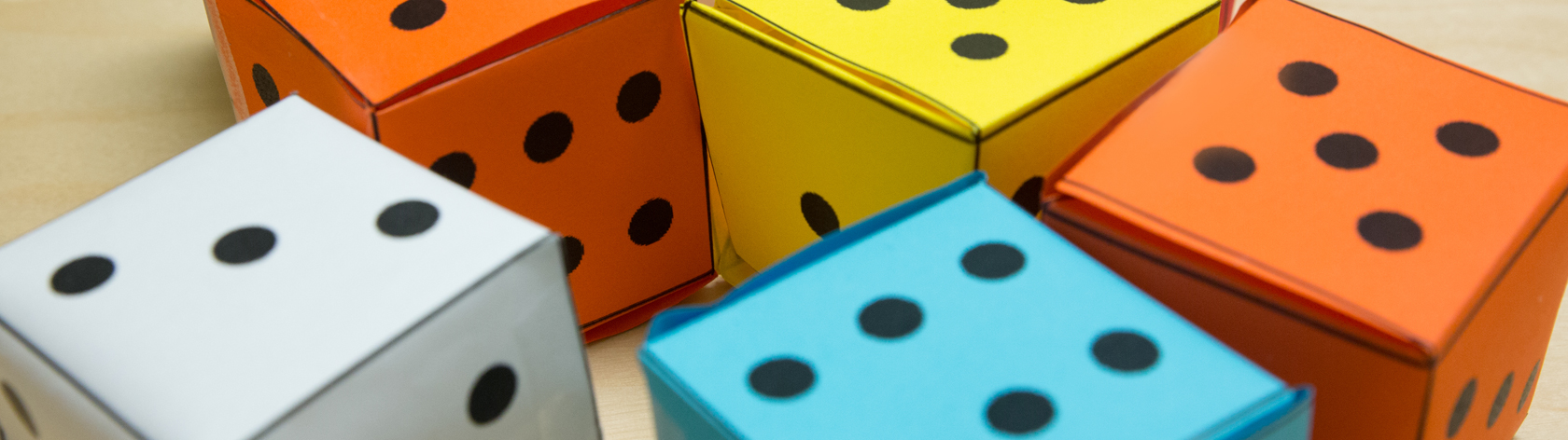 Grouping of big paper dice in different colors