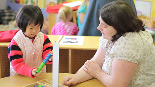 Teacher working with child Teacher working with child
